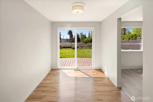 house is virtually staged so this is the dining area looking into backyard