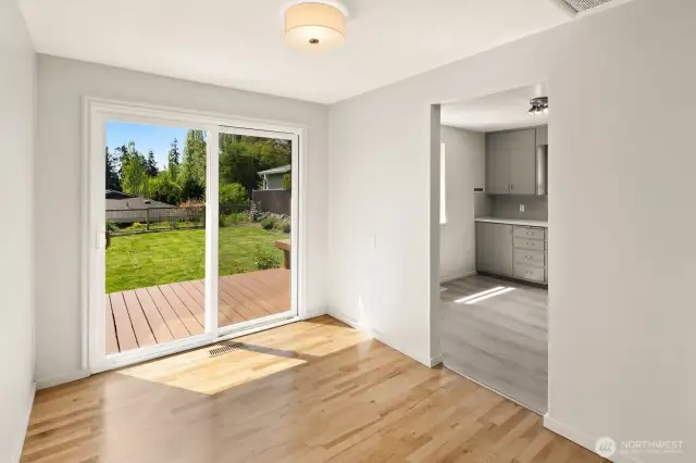 house is virtually staged so this is the dining area looking into backyard