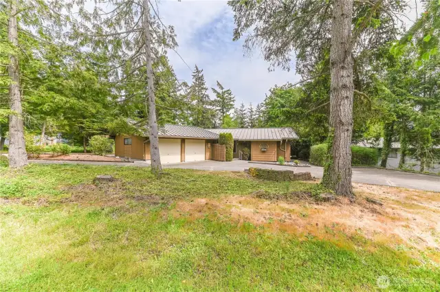 FEE SIMPLE in the highly sought-after community of SHELTER BAY! This custom-built rambler offers exceptional privacy, ample parking, generous storage,2 spacious brms, large office, primary suite is a true retreat, deck access, a spa-inspired jetted tub, separate shower & LRG walk-in closet. Sip your morning coffee on the covered back deck while watching the local deer. Shelter Bay is a lifestyle community packed with amenities: golf course, private beaches, clubhouse, swimming pool, multiple sport courts, parks, marina, and a boat launch. Everything you need is right here—you’ll only leave for provisions! Just minutes from the charming town of La Conner, this is your chance to live like you're on vacation year-round. LOVE WHERE YOU LIVE!