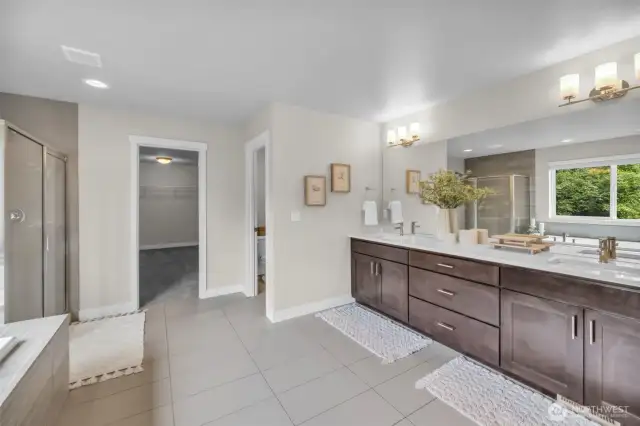 Primary ensuite with double sinks, deep soaking tub, stand alone shower & plenty of space.