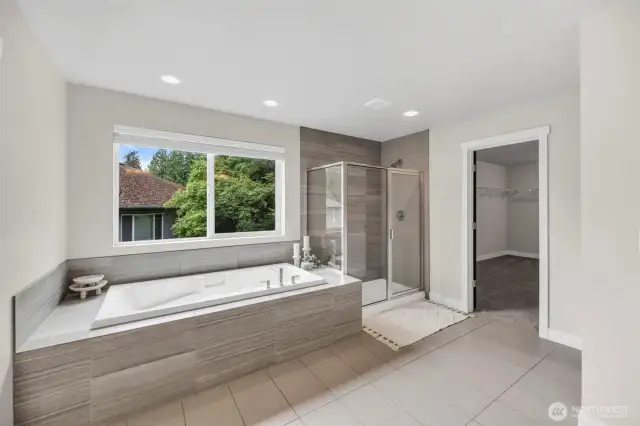 Ensuite bath leading to the largest walk-in closet you have ever seen.