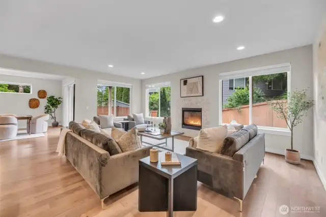 Great room with gas fireplace & so much light.