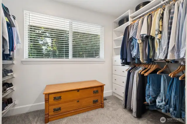 You will love this large walk-in closet, with installed organization, including plenty of room to add a dresser or other additional storage.  We appreciate the big window to let daylight in so you don't mix up your blacks & navies!