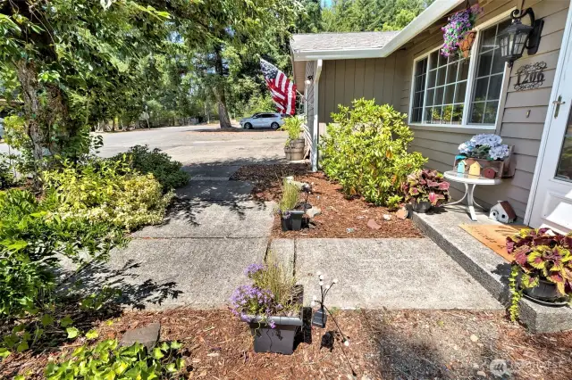 Nice front patio area with easy-care landscaping. Lots of off-street parking here!