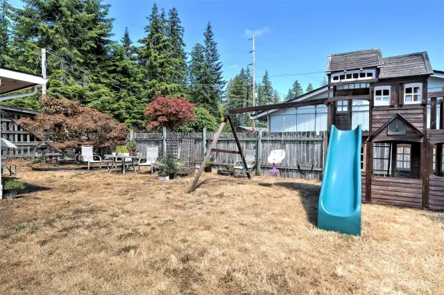 Nice big fully-fenced back yard - playset can be negotiable. The seller will take it if you don't want it.