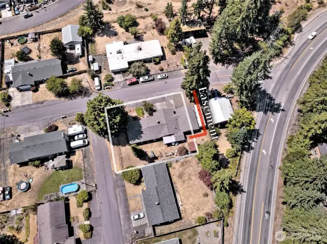 Property boundaries are approximate. The red-outlined easement refers to a wonderful easement from the neighbor allowing the carport to stay, and the seller to use the area for extra parking! Ask the Sellers Broker for details.