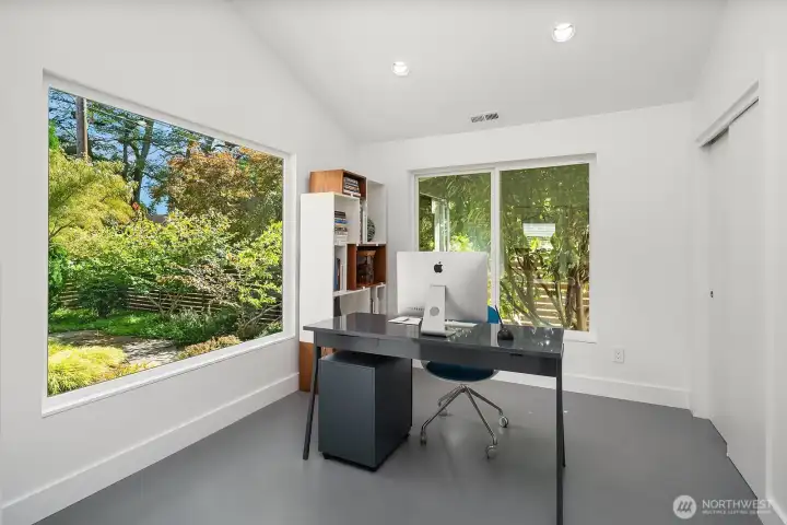 Home office with large windows