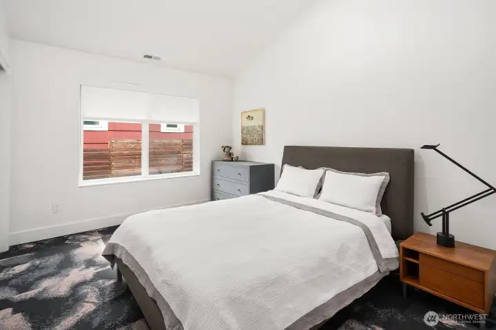 Guest bedroom w/ carpet tiles