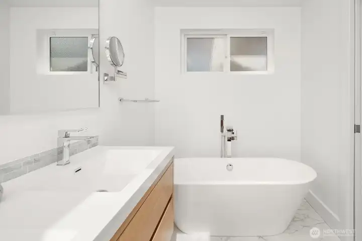 Primary bathroom w/ standalone tub in