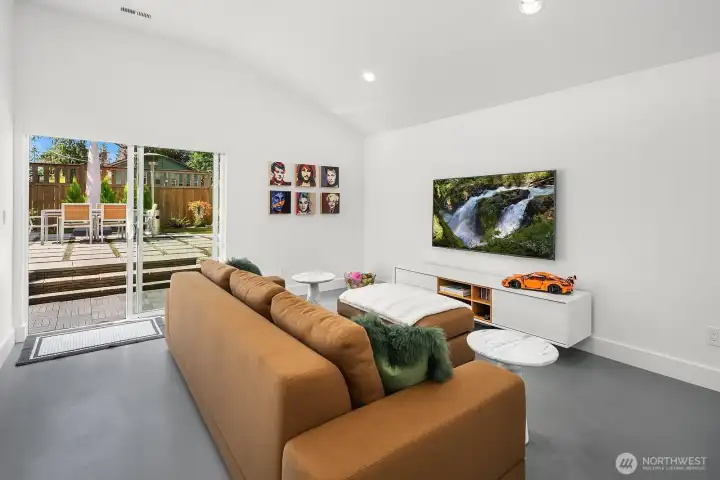 TV room with backyard patio access