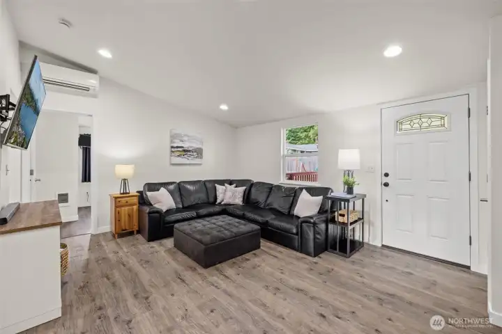 Spacious living room with vaulted ceiling.