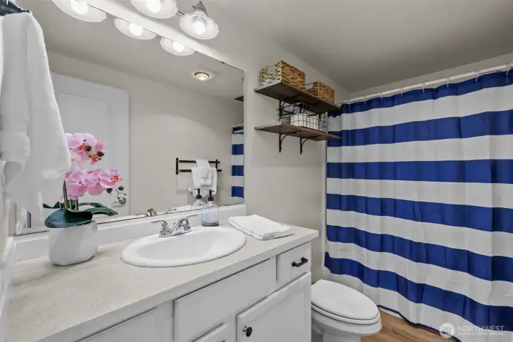 Two bedrooms share this full bathroom.
