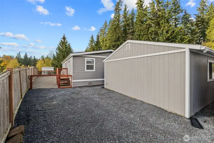 Back elevation of garage/shop and home.