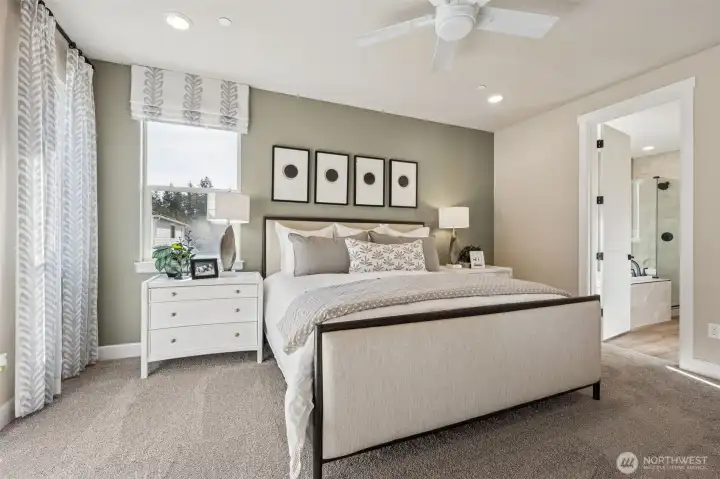 Primary bedroom. Photo is of the model, colors and finishes may vary.