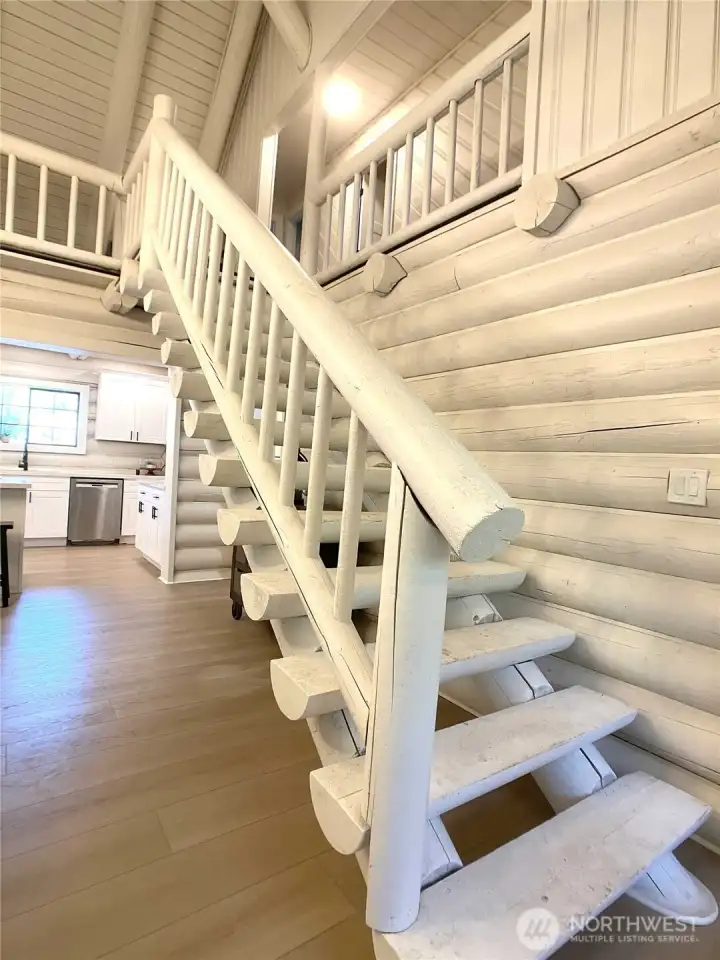 Stairs lead to the loft, 3 bedrooms, and hall bathroom