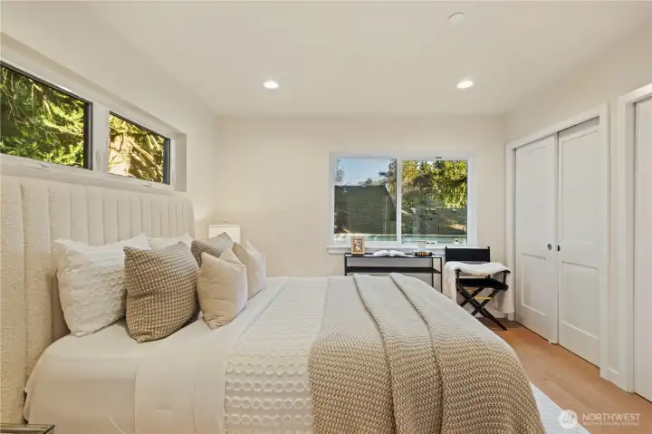 His and her closets in the primary. Spacious bedroom sizes!