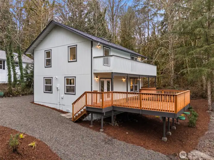 Island living with large deck for relaxation & entertaining with water view Island living with large deck for relaxation & entertaining with water view