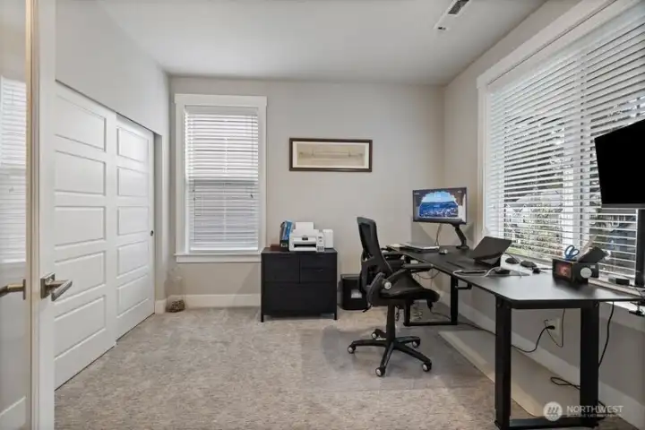 As you enter the home, the main floor bedroom offers options as guest room or office