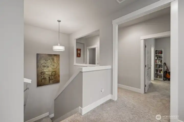 On the second floor landing opens to loft space, guest bedrooms and primary bedroom