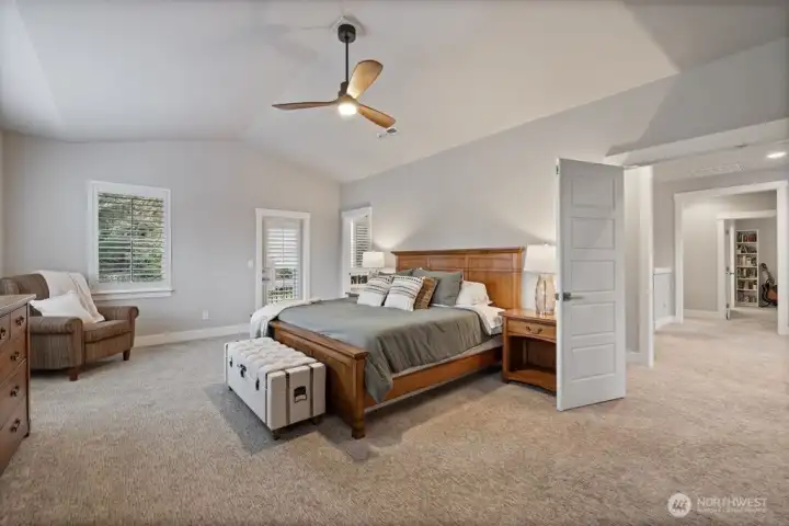 Grand entrance to the spacious and light Primary suite with ceiling fan, 2 walk in closets