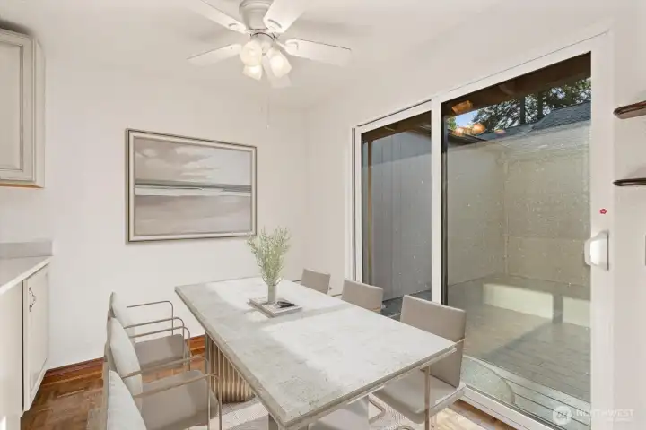 Virtually stage eating space over with sliders that open up to your private courtyard. Stringn the lights and start the grill, summer is on it's way!