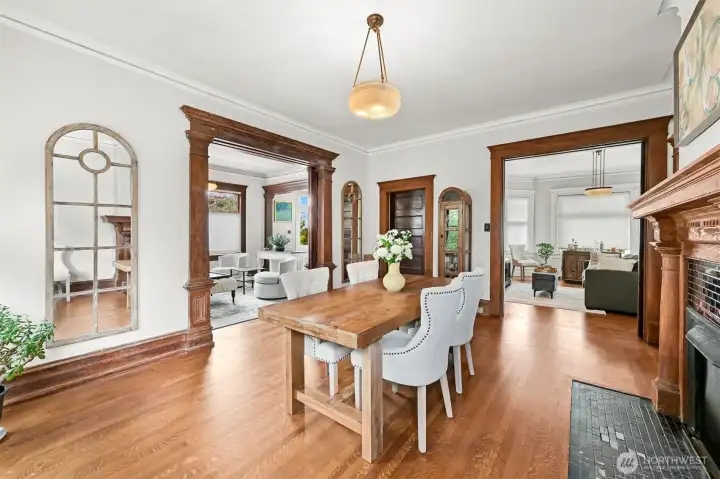 Dining room with fire place and original sliding doors.