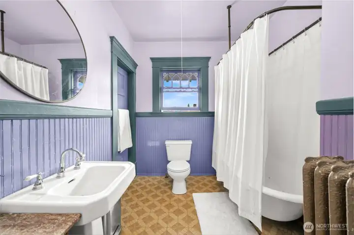 Claw foot bathtub upstairs with walk in closet