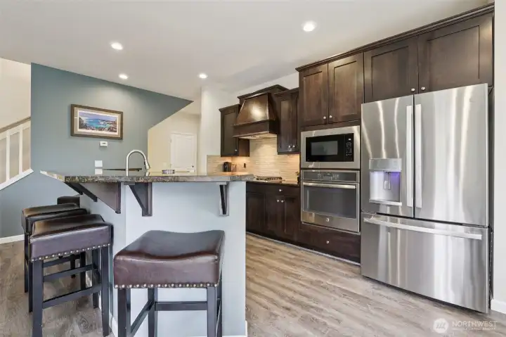 Functional Kitchen with stainless steel appliances and gas cooktop and pantry