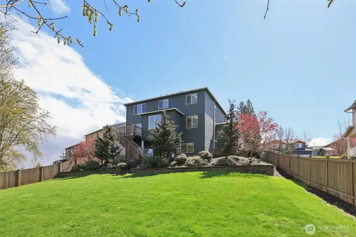 Fully fenced back yard has plenty of room for your pets to roam
