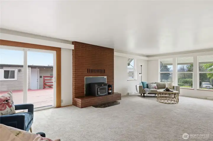 The spacious living room centers around a pellet fireplace.