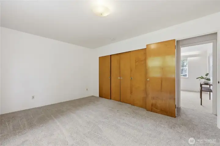 Gorgeous wood doors to the closet in the primary bedrrom.
