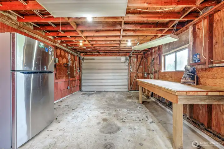 A work table and extra refrigerator.