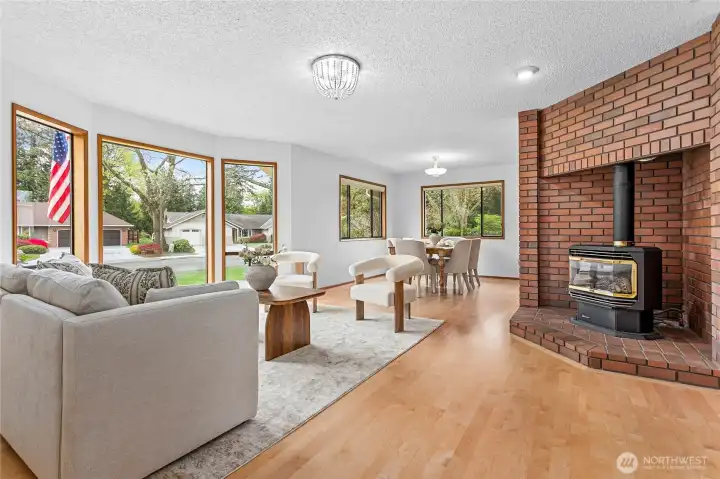 Cozy, yet light and bright living room is open to the dining area. So much natural light as this is a south facing home.