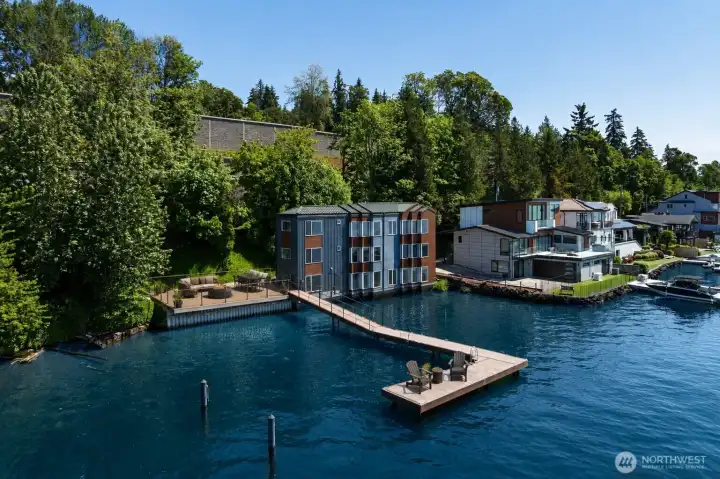 Welcome to Renton waterfront living where panoramic lake views, private shoreline, and direct water access set the stage from the moment you arrive. This exceptional waterfront property features a private dock with boat lift, swim beach, and expansive outdoor spaces designed for boating, entertaining, and everyday enjoyment on the water. Experience the rare combination of modern waterfront living, private moorage, and a setting that makes every day feel connected to the lake.Virtually Staged.