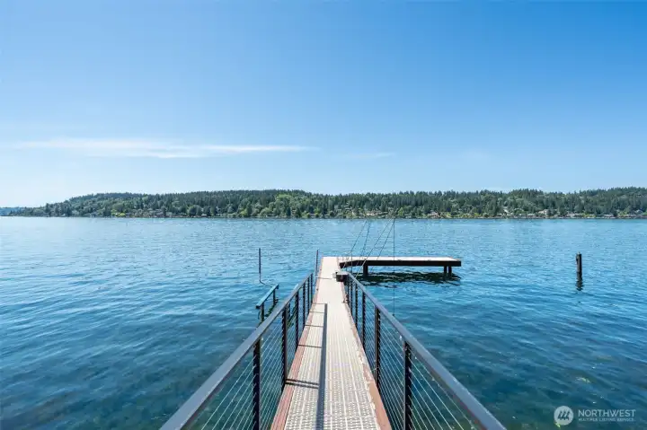 Extend your living experience onto the water with an impressive 70’ dock offering direct lake access, power availability, and room for boating, fishing, and waterfront recreation. Stretching out into open water, this private dock creates the perfect setting to enjoy panoramic views and life on the shoreline.