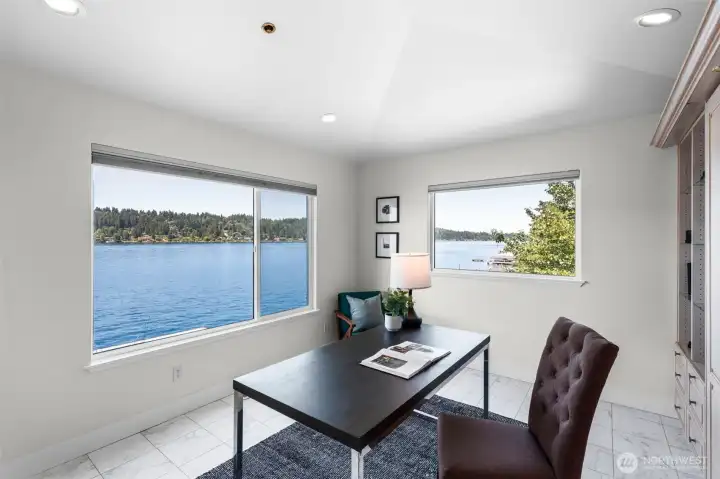 This versatile second-level bedroom offers the flexibility to function as a home office, guest space, or private retreat while capturing beautiful waterfront views from oversized windows. Complete with a built-in Murphy bed, this room easily adapts to fit your lifestyle without sacrificing space or functionality.
