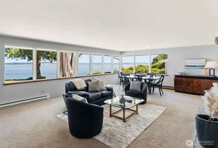 Expansive windows in the living and dining areas capture sweeping views of the ever-changing shipping lanes of Puget Sound and the picturesque shores of Whidbey Island. Expansive windows in the living and dining areas capture sweeping views of the ever-changing shipping lanes of Puget Sound and the picturesque shores of Whidbey Island.