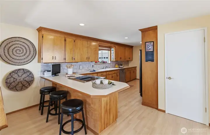 The kitchen features a welcoming eating bar, perfect for casual meals and conversation. The kitchen features a welcoming eating bar, perfect for casual meals and conversation.