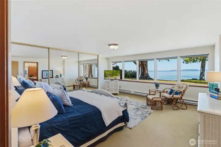 Wake each morning to captivating views of Puget Sound from the primary bedroom. Wake each morning to captivating views of Puget Sound from the primary bedroom.