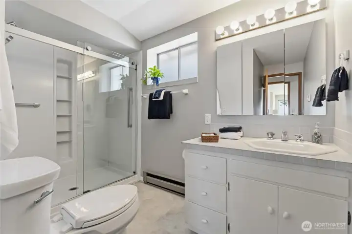 Conveniently located near the living room and flex space, this 3/4 bathroom is easily accessible for guests and everyday living. Conveniently located near the living room and flex space, this 3/4 bathroom is easily accessible for guests and everyday living.