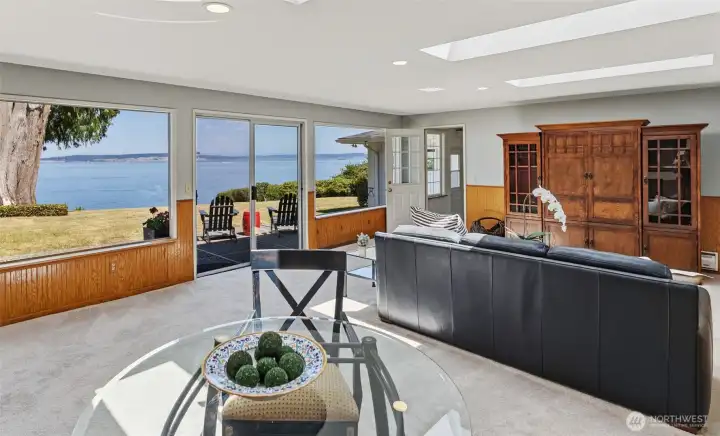 The family room features expansive windows, new skylights and sliding glass doors for a relaxing indoor outdoor flow. The family room features expansive windows, new skylights and sliding glass doors for a relaxing indoor outdoor flow.