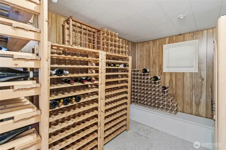 An oversized closet in the guest wing has been thoughtfully converted into a charming wine room. An oversized closet in the guest wing has been thoughtfully converted into a charming wine room.