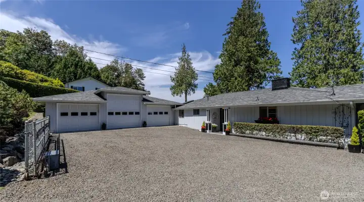 The spacious three-car garage offers ample room for vehicles, storage, hobbies, or a workshop. The spacious three-car garage offers ample room for vehicles, storage, hobbies, or a workshop.