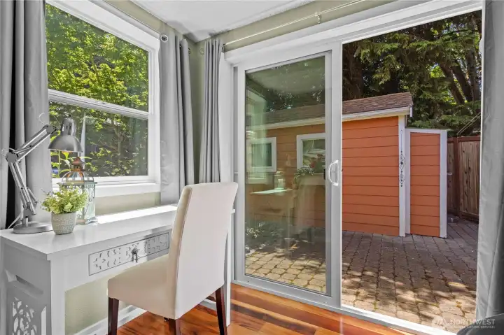 Primary bedroom slider to the side yard