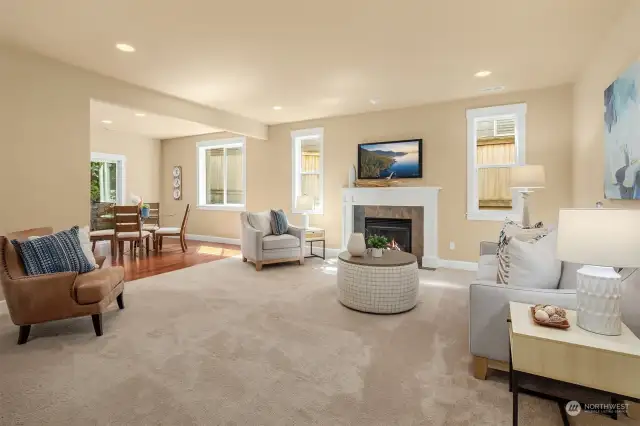 Very large living room space with gas fireplace opens to the kitchen and eating nook.