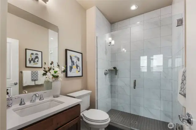 Main floor bathroom next to main floor bedroom offers privacy for guests.