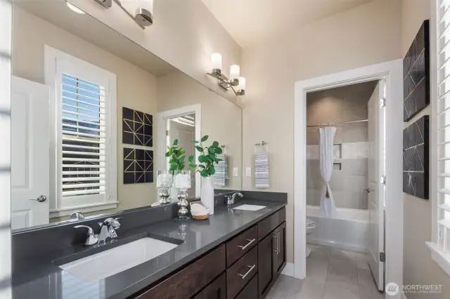 Upstairs restroom with designer modern quarts counters.