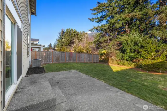 Large and private backyard with greenbelt just waiting for your personal design touches.