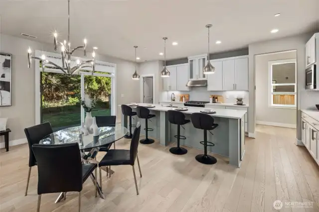 Oversized light and bright kitchen with quartz counters tons of storage walk in pantry and so much more!