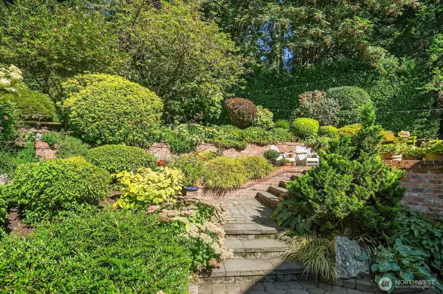 Stone steps, brick retaining walls and 2 oversized patios